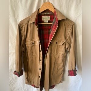 LL Bean tan chore jacket with red and green plaid flannel lining.